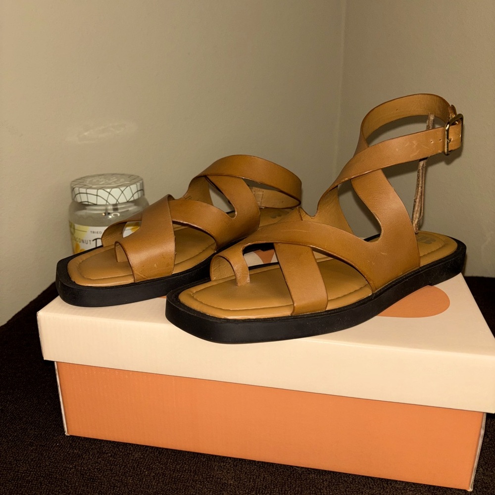 Brand new sandals; very cute, nice, & comfortable with black sole.
